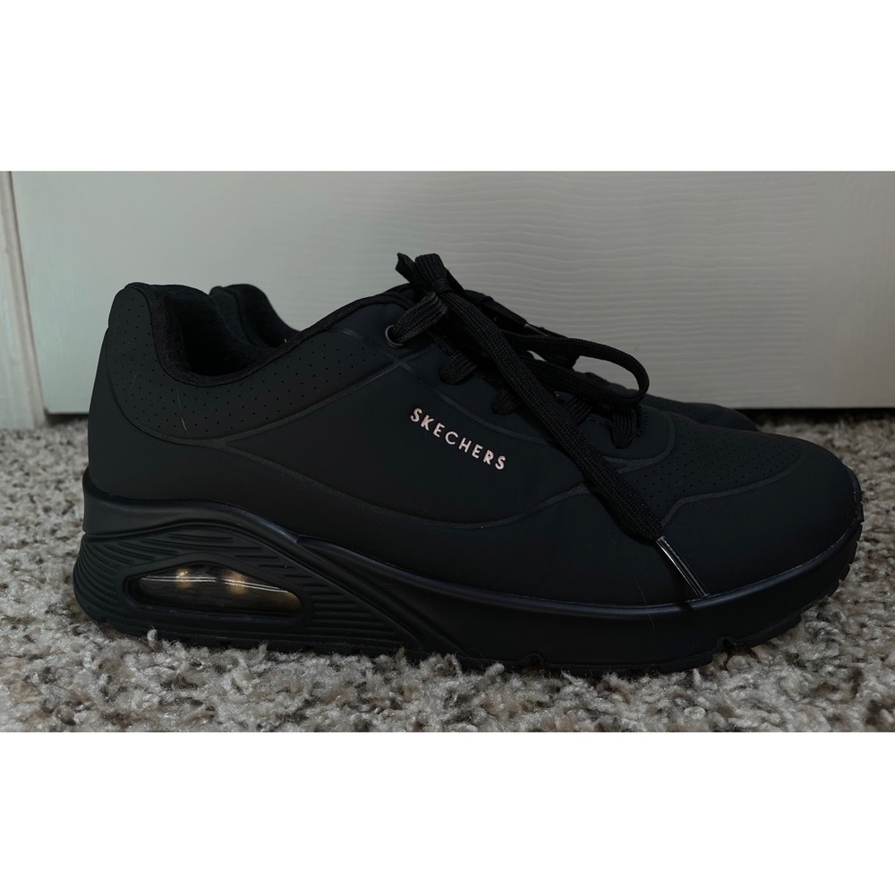 All black “Stand on Air” Skechers sneakers with rose gold accents